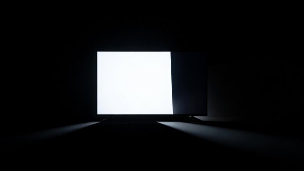 High contrast television display showing deep black levels in a darkened room